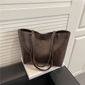 Minimalist dark brown retro tote bag with vintage leather texture and gold logo text - Coffee