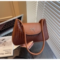 Brown patchwork underarm bag with crocodile texture, matte leather and silver bow buckle - Brown