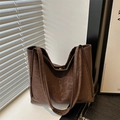 Brown leopard print suede tote bag with double handles in a natural light setting - Coffee Without Pendant