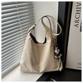 Detail of off-white suede tote bag with cute plush dog pendant and spacious interior - White With Pendant