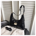 Elegant black crescent shoulder bag with glossy finish and gold square buckle detail - Black