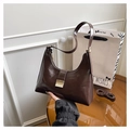 Elegant dark brown leather hobo bag with a golden metal buckle and adjustable strap - Coffee