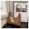 Elegant dark brown glossy baguette bag with gold metal buckle and sleek shoulder strap - Brown