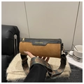 Close-up of brown suede cylinder bag featuring patterned wide strap and gold hardware detail - Brown