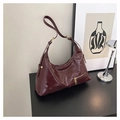 Chic burgundy patent leather hobo bag with gold hardware for a retro casual look - Red
