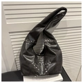 Detail of black faux leather hobo bag with silver star-shaped metal studs in punk style - Black