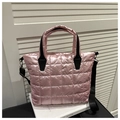 Pink quilted tote bag with black handles and detachable shoulder strap in chic style - Pink