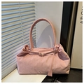 Detail of pink corduroy tote bag showing soft ribbed fabric texture and leather buckle strap - Pink