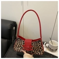 Leopard print underarm bag with red patent leather trim and a decorative bow - Red