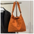 Detail of orange drawstring tote bag with textured fabric and adjustable wide shoulder strap - No Pendant / Orange
