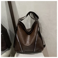 Detail of vintage brown tote bag featuring soft pleated leather and parallel silver zippers - Coffee