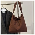 Detail of dark brown nylon tote with drawstring closure and fashion woven label - No Pendant / Coffee
