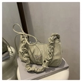 Sage green crescent bag featuring ruffled handle and silver butterfly buckle detail - Green
