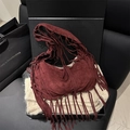 Chic burgundy suede tote bag with fringe details displayed in a luxury black gift box - Red