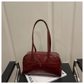 Macro shot of dark red glossy faux leather texture and silver zipper on shoulder bag - Red Without Charm