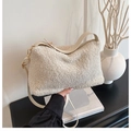 Creamy white lamb wool tote bag with golden metal hardware and leather shoulder strap - White