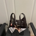 Retro brown oil wax leather shoulder bag with a cute pendant and external zipper pocket - Brown