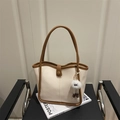 Minimalist white canvas underarm tote bag with brown leather trim and plush charm - With Monster Pendant / White