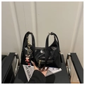 Detail of black hobo bag in glossy leather with gold hardware and a cute calf charm - Black