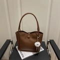 Retro dark brown leather tote bag with long handles and a white plush charm accessory - With Monster Pendant / Brown