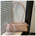 Detail of light pink shoulder bag with lace bow decoration and glossy leather texture - Pink
