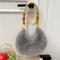 Grey plush crescent handbag featuring beaded wooden handle and woven texture detail - Gray