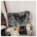 Chic faux fur shoulder bag with black and white patterns and a chunky silver chain strap - Black