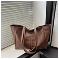 Detail of coffee brown tote bag with vintage wrinkled texture and circular embossing - Brown