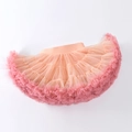 Detailed view of layered light orange gradient tutu skirt with elastic waistband for girls - XS (60-80cm) / Peach Coral