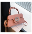 Pink pleated crossbody bag with sparkling rhinestone buckle and suede-like finish - Pink