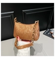 Close-up of bronze velvet handbag with pleated texture and acrylic chain detail - Brown