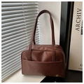 Detailed close-up of brown PU leather shoulder bag with exterior pocket and metal zipper - Brown