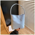 Detail of light blue bucket bag with Hope and Future embroidery on canvas fabric - Blue