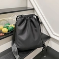 Minimalist black nylon drawstring backpack with wide straps for casual school or travel use - Black
