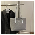 Detail view of leopard print fabric tote bag with white FASHION logo and silver straps - Silver