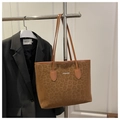 Macro view of leopard print tote bag featuring FASHION text and suede texture detail - Brown