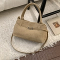 Close-up of brown suede bucket bag featuring leather belt buckle and silver hardware - No Pendant / Khaki