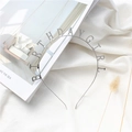 Detail shot of silver Birthday Girl metal headband on a minimalist aesthetic background - Silver