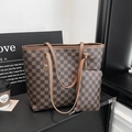 Detailed set of brown checkered tote bag and matching clutch on a minimalist table - Brown