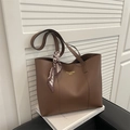 Minimalist dark brown large tote bag with golden logo and decorative silk scarf detail - Brown