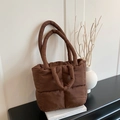 Quilted down tote bag in dark brown with dual handles and puffy winter aesthetic - Brown