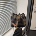 Plaid woolen drawstring bucket bag with gold chain strap and elegant pearl charms - Black