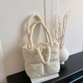 Minimalist cream white quilted tote bag with padded cloud-like nylon texture and handles - White