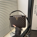 Retro monogram crossbody bucket bag with golden V-logo and adjustable strap - Brown