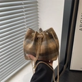 Chic woolen drawstring bucket bag with classic plaid pattern and pearl chain strap - Brown