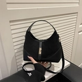 Borsa a tracolla nera patchwork con elegante chiusura a girello in metallo dorato - Nero