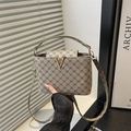 Chic beige and brown bucket bag with monogram pattern and gold V-shaped metal buckle - Gray