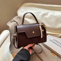 Dark brown patchwork crossbody bag with gold buckle and beaded tassel detail - With Pendant / Brown