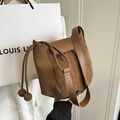 Brown suede and leather bucket bag with wide strap and minimalist flap design - Brown