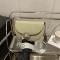 Chic sage green saddle bag with sparkling G buckle and woven geometric shoulder strap - Green